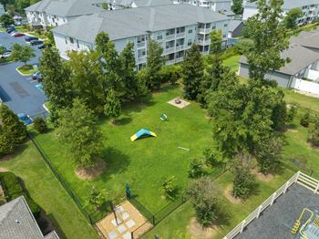 An aerial view of a backyard with a trampoline